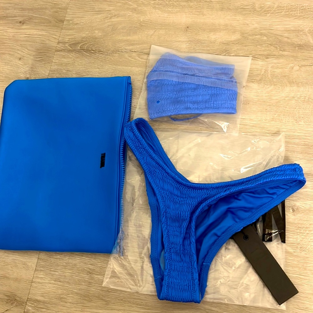 Mica triangl suit size s top and xs bottom. Never worn and with tags